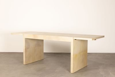 an image of a wooden table in a white room