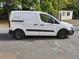 a white van that is parked in the parking lot