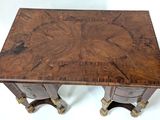 a small wooden table with two drawers on it