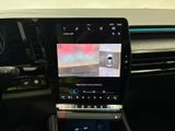 the interior of a car with a digital display on the dashboard