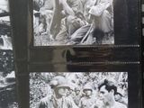 several black and white photos of soldiers in military uniforms on a table