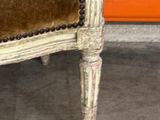 a chair that is sitting in a room with a wall in the background