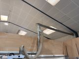 a metal pipe that is attached to the ceiling