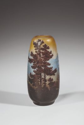 a small vase with a picture of a tree on it