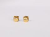 a pair of gold stud earrings on a white background