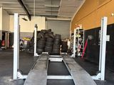 an image of a garage with a lot of tires on the floor