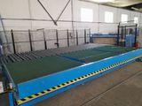 an image of a factory with a conveyor belt in the middle of it