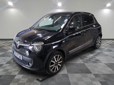 a picture of a small black car parked on a checkered floor