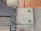 a close up of a piece of metal on a piece of wood