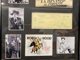 a display of old movie posters on display in a glass case