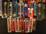 many spoons and spoon spoons on display in a store