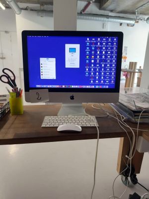 a desktop computer sitting on a desk with a keyboard and mouse