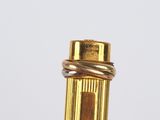 a close up picture of a pen with a gold cap
