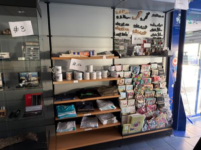 a display case with many items in it in a store