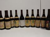several bottles of wine are lined up in a row on a table