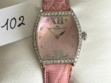 an image of a pink watch with diamonds on a pink leather strap