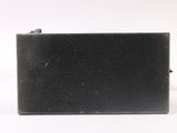 an image of a black purse sitting on top of a white surface