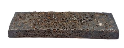 a brick with holes in it on a white background