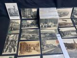 many old postcards of different types and sizes are on a table