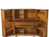an image of a wooden desk with a book shelf and a chair