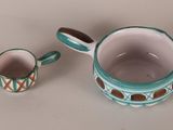 a cup and a saucer sitting on a table