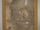 a picture of a bird that is standing in the water