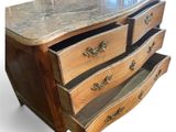 a marble top chest of drawers on a white background
