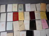 a lot of old papers that are on a table