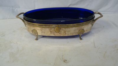 an image of a blue glass bowl sitting on top of a white table