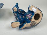two blue vases that are sitting next to each other