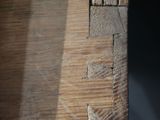a close up of a piece of wood with a piece of wood sticking out of it
