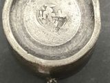 a close up of a silver cup with a horse on it