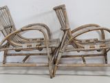 pair of antique bamboo chairs with arms and legs