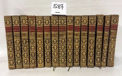 a set of eight books with gold and red covers