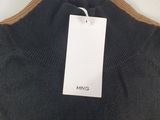 a close up of a black sweater with a tag on it