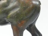 bronze statue of a horse with a saddle on its back