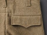 the back of a pair of pants with a pocket on a table
