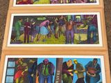 several paintings of people are displayed on the floor of a room