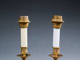 pair of antique brass candlesticks with frosted glass shades