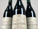 three bottles of wine sitting on top of a table next to each other