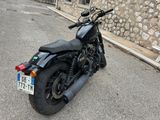 a motorcycle that is parked on the side of the street