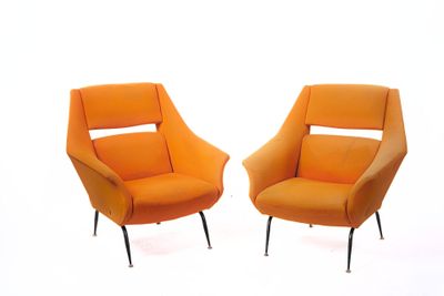 pair of orange chairs with black legs against a white background