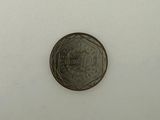 an image of a coin on a white surface with a white background
