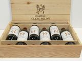 six bottles of wine in a wooden box