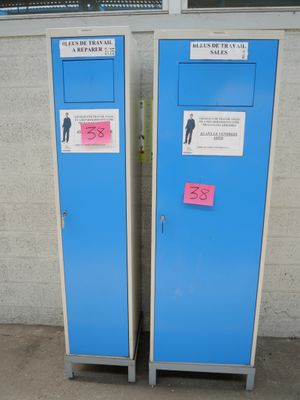 two blue lockers next to each other on a sidewalk