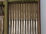 many forks and spoons in a box on the table