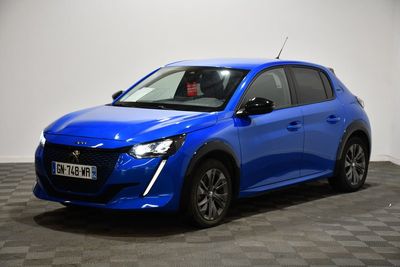 a blue car is parked in a room with a checkered floor