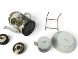 a tea pot, tea pot and other items on a white surface