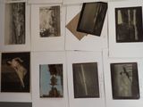 many photographs hanging on the wall of a room