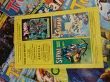 a lot of comic books on the table together